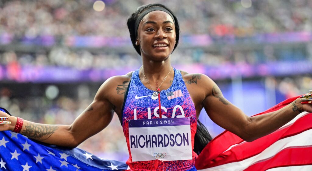 Sha'Carri Richardson holding USA flag