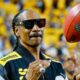 Snoop Dogg in Steelers jacket and throwing football