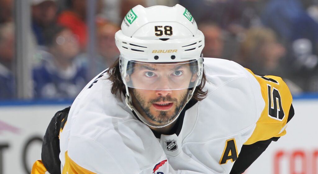 Kris Letang looking on during game.