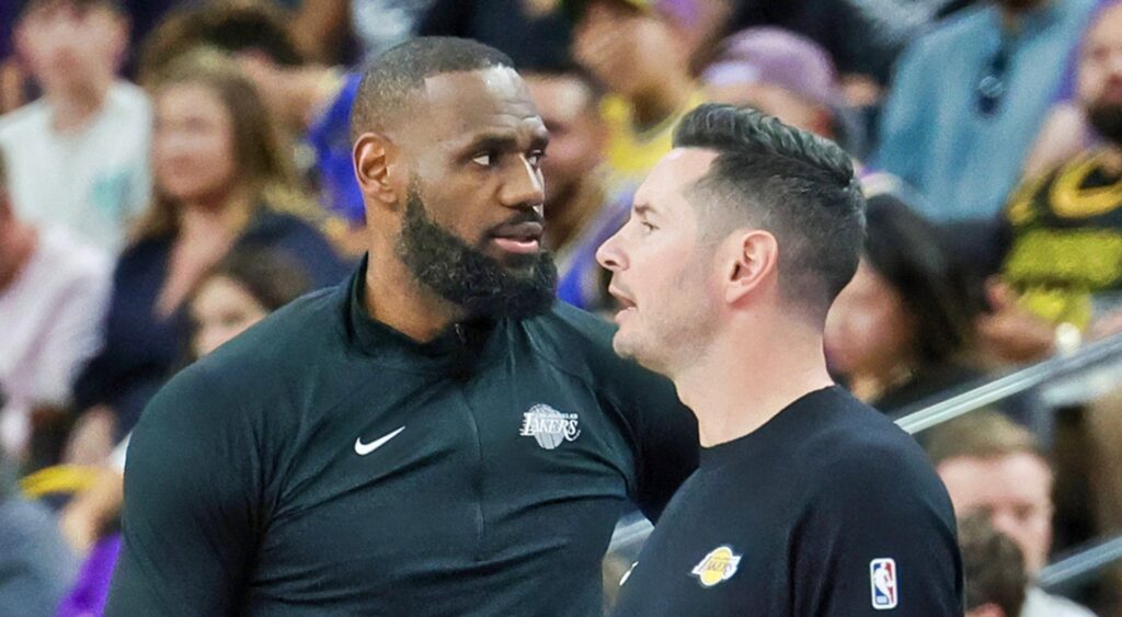 LeBron James and JJ Redick speaking at game.