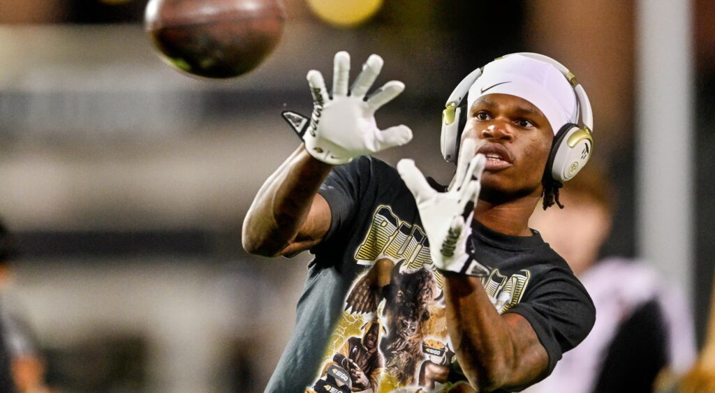 Travis Hunter catching a football