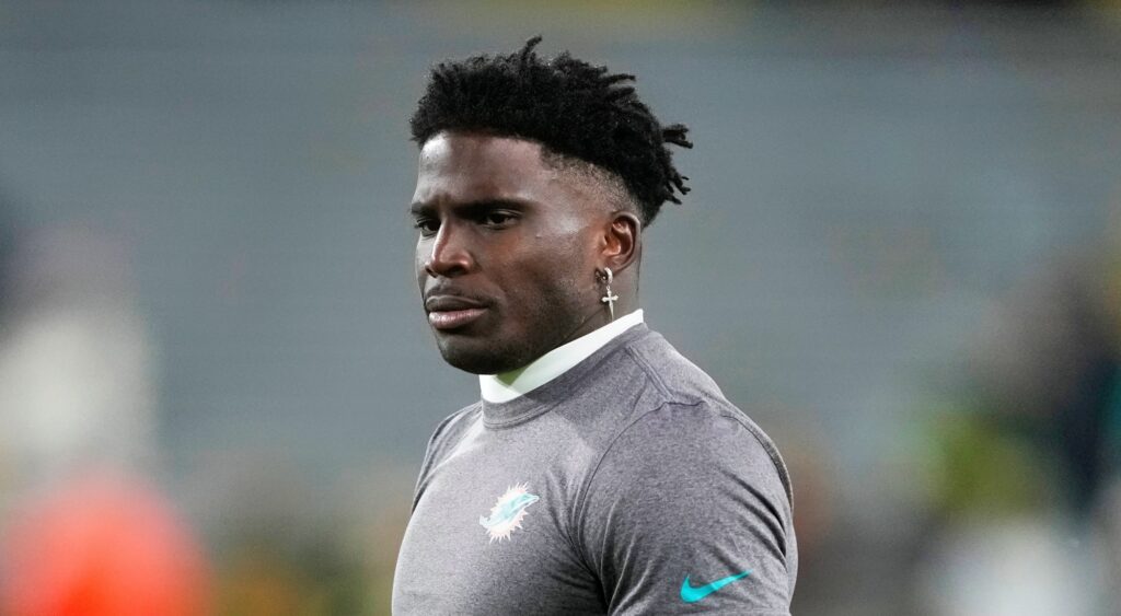 Tyreek Hill of Miami Dolphins looking on.