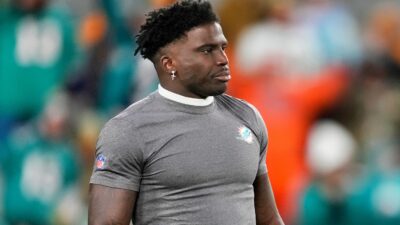 Tyeek Hill in Dolphins shirt