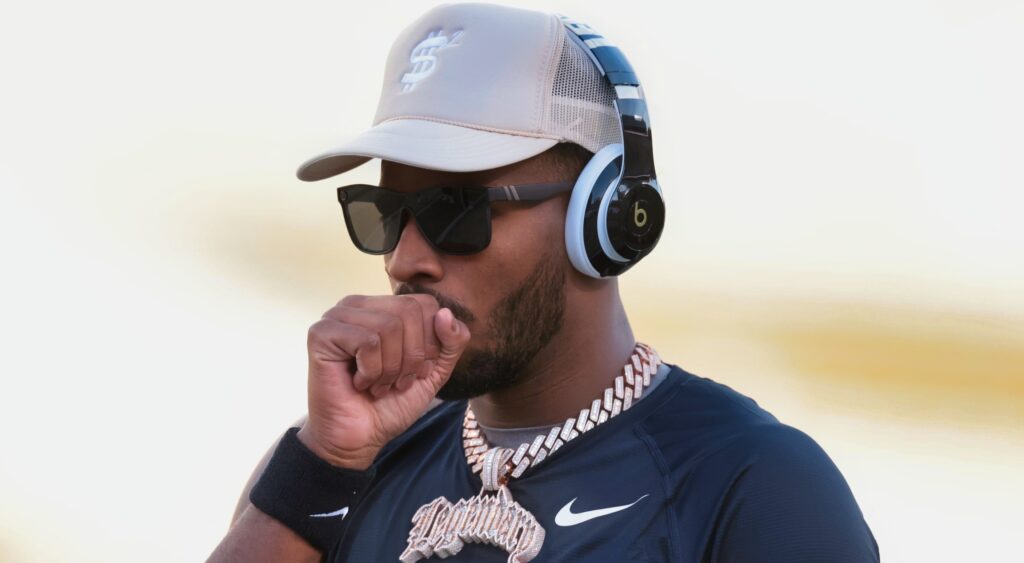 Shedeur Sanders with a hand on his mouth