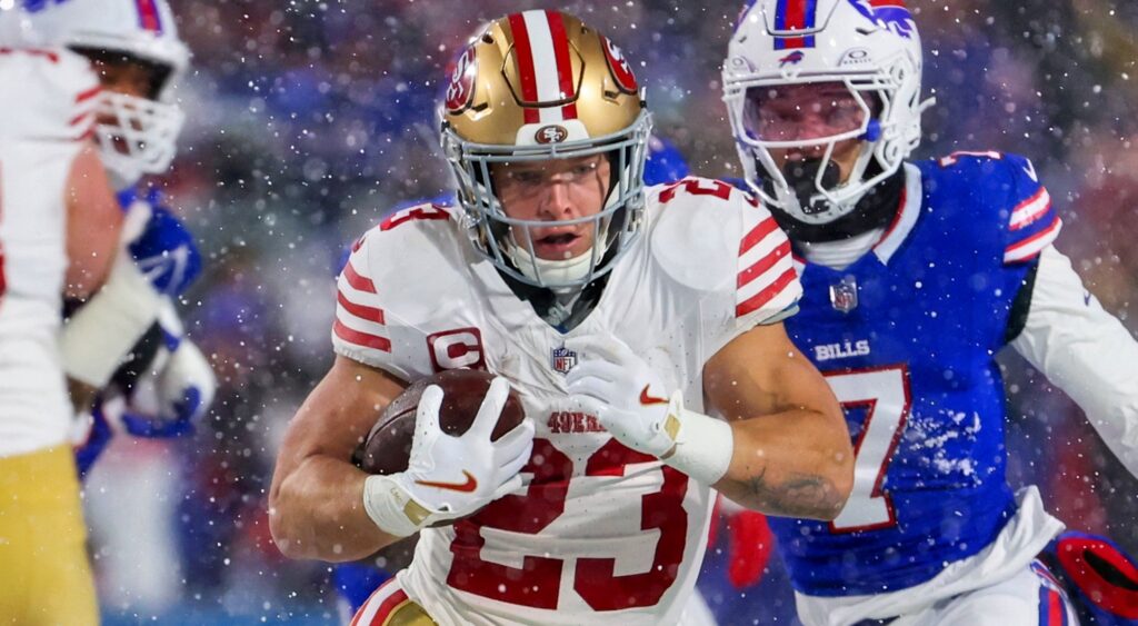 Christian McCaffrey of San Francisco 49ers looking on.