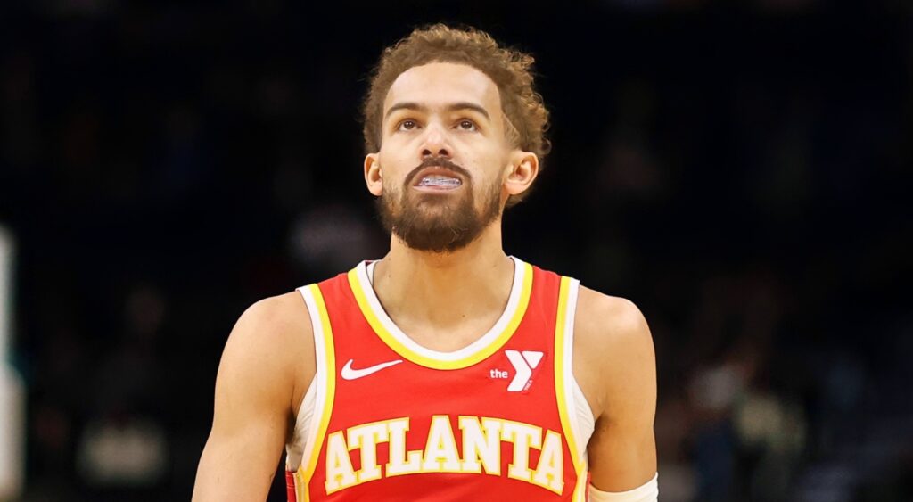 Trae Young of Atlanta Hawks looking on.