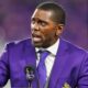 Randy Moss in purple suit