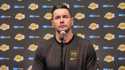 Head coach JJ Redick of the Los Angeles Lakers attends a news conference before a preseason game