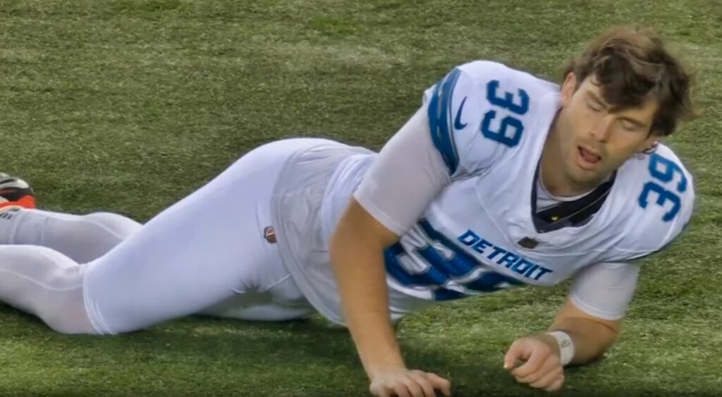 Jake Bates stretching on field