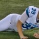 Jake Bates stretching on field