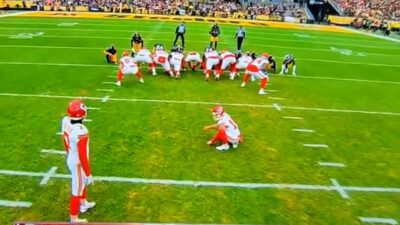 Kansas City Chiefs and Steelers players on field