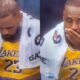 LeBron James taking a pill on the Lakers bench