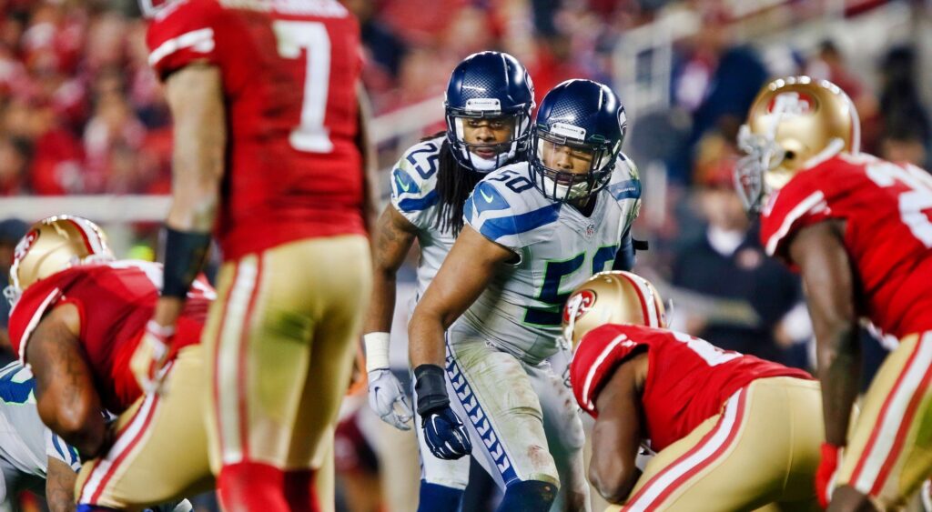 Cornerback Richard Sherman and linebacker K.J. Wright #50 of the Seattle Seahawks threaten with a blitz against quarterback Colin Kaepernick of the San Francisco 49ers