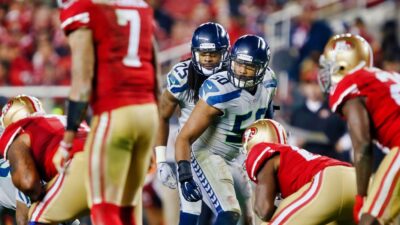 Cornerback Richard Sherman and linebacker K.J. Wright #50 of the Seattle Seahawks threaten with a blitz against quarterback Colin Kaepernick of the San Francisco 49ers