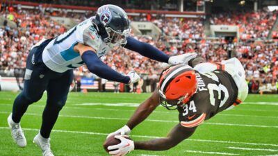 Jerome Ford of the Cleveland Browns dives for a touchdown against Jack Gibbens of the Tennessee Titans