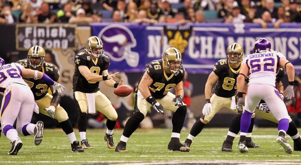 Drew Brees of the New Orleans Saints receives the snap in the shotgun formation against the Minnesota Vikings during the NFC Championship Game at the Louisana Superdome on January 24, 2010