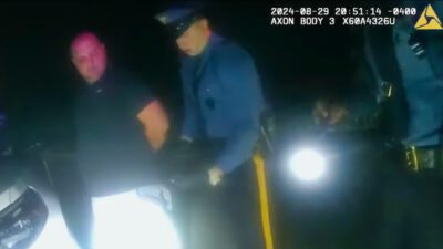 Sean Higgins being handcuffed after fatal accident