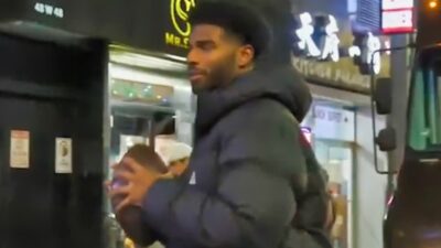 Shedeur Sanders holding football