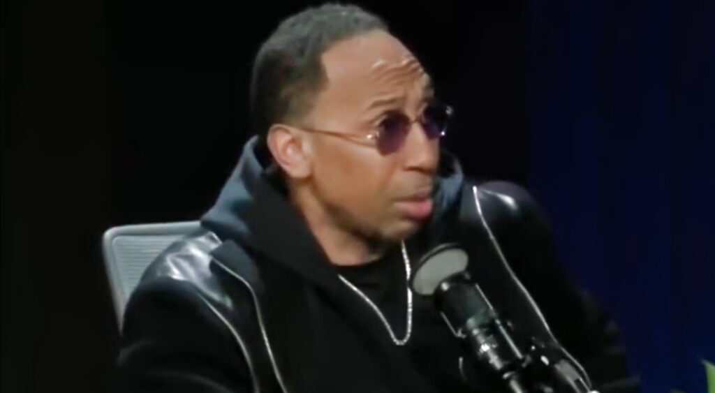 Stephen A Smith speaking into mic