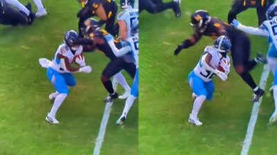 Photos of Tennessee Titans player having his facemask spun by Washington Commanders player