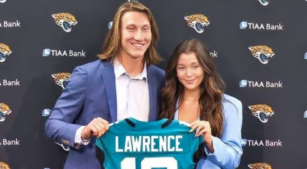 Trevor Lawrence posing with wife