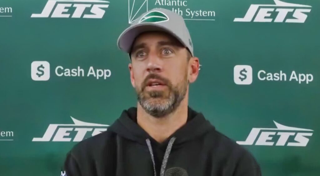 Aaron Rodgers of New York Jets looking on.