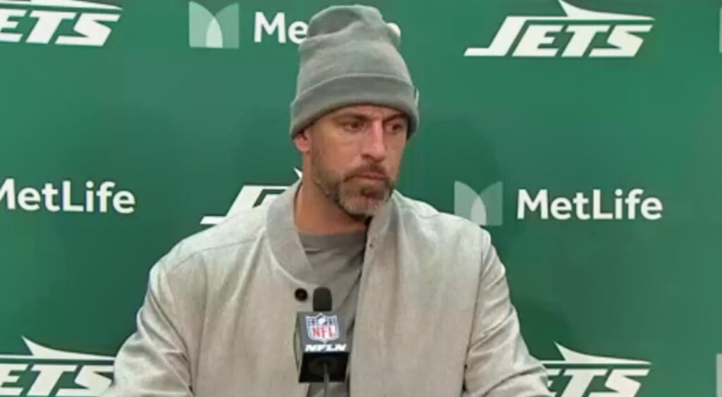 Aaron Rodgers of New York Jets looking on.