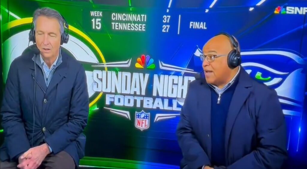 Cris Collinsworth and Mike Tirico speaking in broadcast booth.