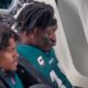 AJ Brown reading on the Eagles bench