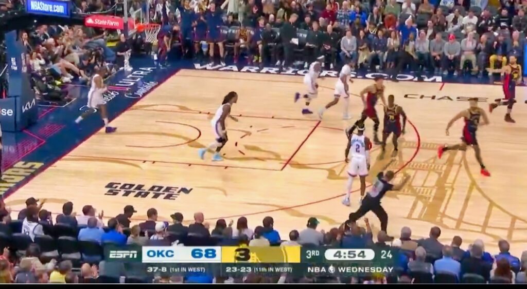 An NBA official accidentally steps over Andrew Wiggins right after the Warriors star drains a three-pointer, sparking reactions