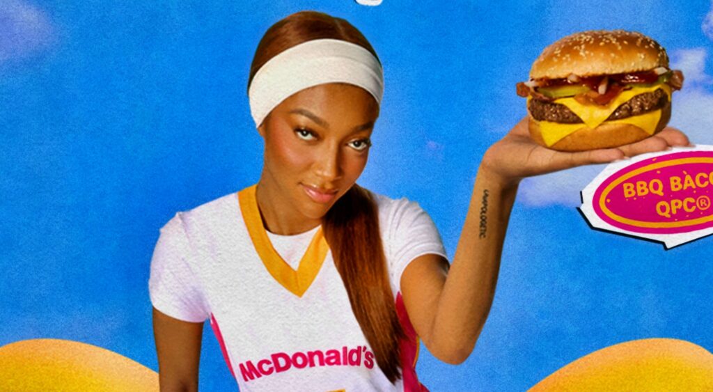 Angel Reese in McDonald's picture holding a burger