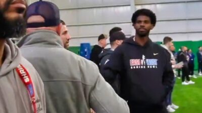 Brian Daboll and Shedeur Sanders shaking hands