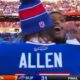 Buffalo Bills' Josh Allen and Courtland Sutton hugging on field