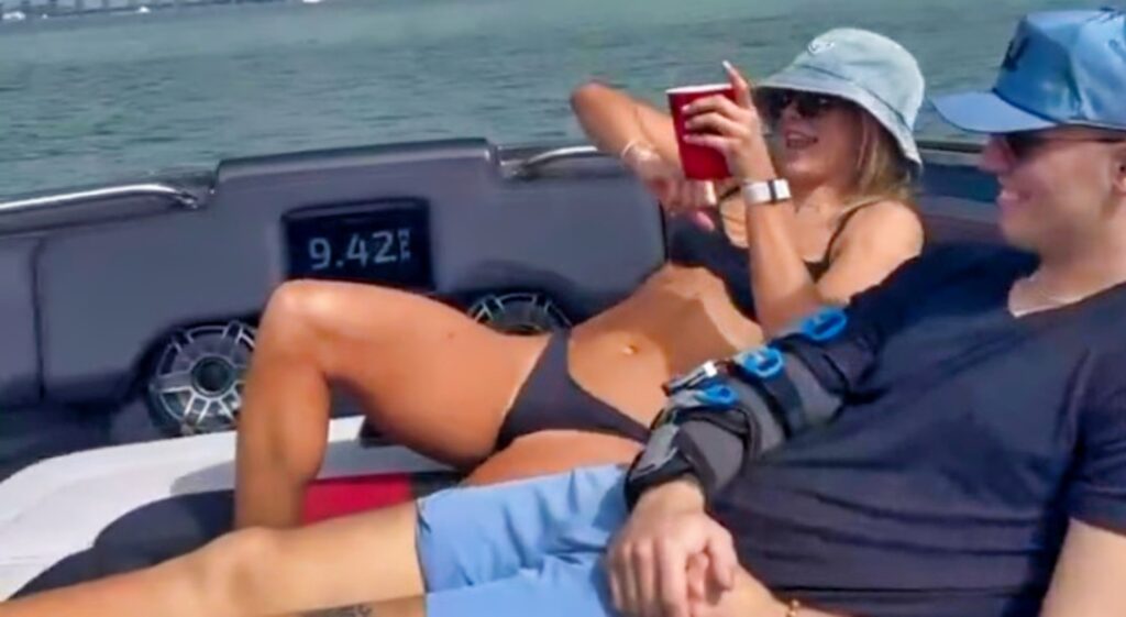 Carson Beck and Hanna Cavinder on a boat.