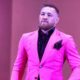 Conor McGregor caught PETA's attention by flaunting Gucci mink fur coats, sparking debate over his controversial fashion choice