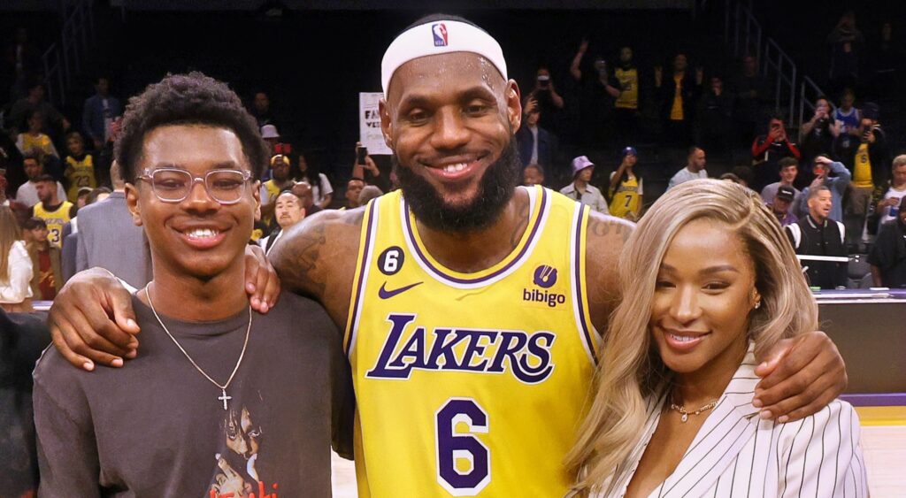 Bryce James, LeBron James and Savannah James smiling for football.