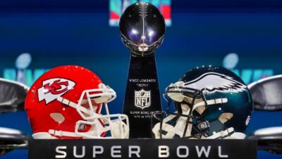 Chiefs & Eagles helmets next to Lombardi Trophy for Super Bowl