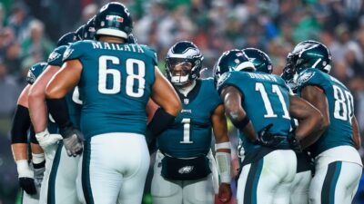 Philadelphia Eagles players in huddle