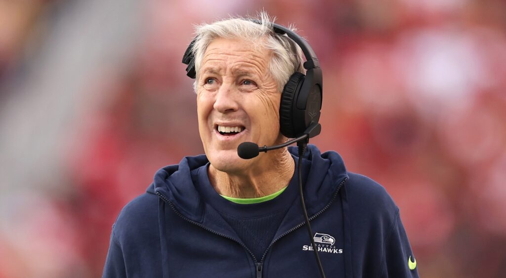 Pete Carroll looking on.