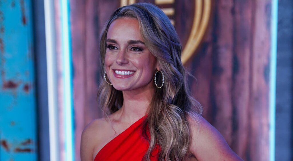 Molly McGrath posing in red outfit