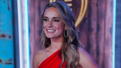 Molly McGrath posing in red outfit