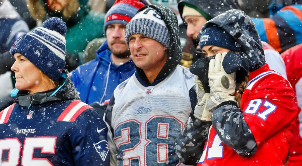 New England Patriots fans react during game. Fans are upset with Jahlani Tavai.