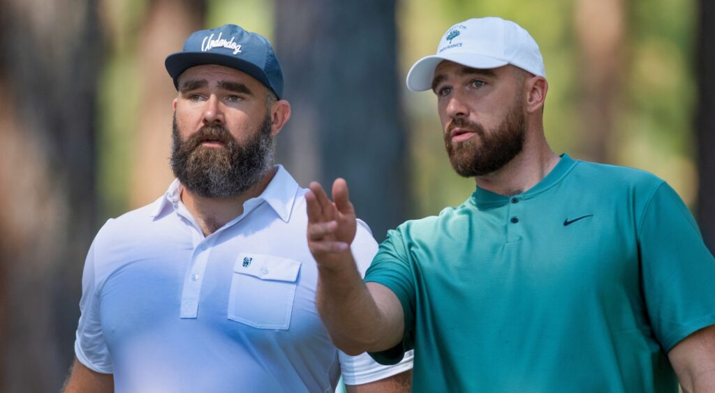 Jason and Travis Kelce talking at golf event.