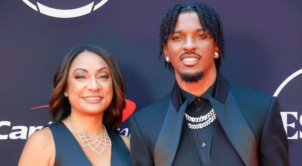 Jayden Daniels and his mother posing at NFL Draft