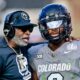 Shedeur Sanders and Deion Sanders on field