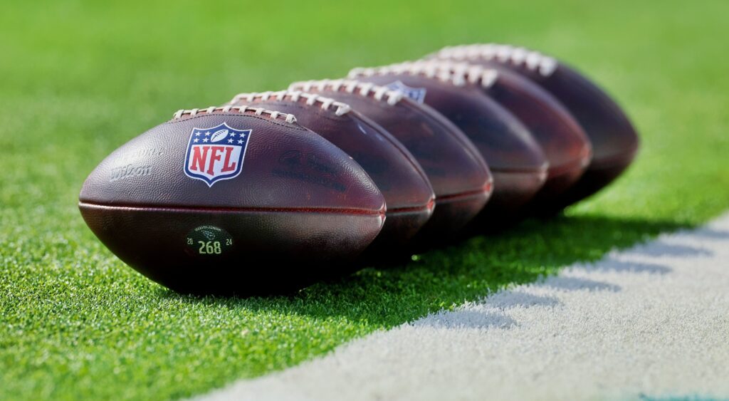 NFL footballs on the field.