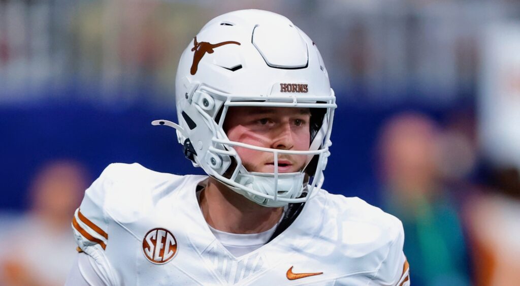 Quinn Ewers of Texas Longhorns looking on.