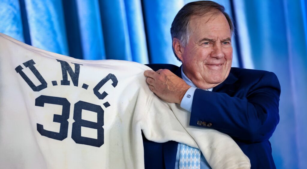 Bill Belichick holding UNC jersey