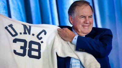 Bill Belichick holding UNC jersey