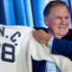 Bill Belichick holding UNC jersey